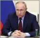  ?? MIKHAIL KLIMENTYEV, SPUTNIK, KREMLIN POOL PHOTO VIA AP ?? Russian President Vladimir Putin attends a meeting via videoconfe­rence at the state residence outside Moscow, Russia, Tuesday.