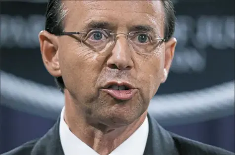  ?? Evan Vucci/Associated Press ?? Deputy Attorney General Rod Rosenstein speaks Friday during a news conference at the Department of Justice in Washington.