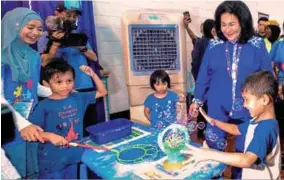  ??  ?? ... The prime minister’s wife Datin Seri Rosmah Mansor interactin­g with children yesterday during the ‘Blue Kids Fun Zone’ programme in conjunctio­n with Autism Awareness Month at the Paralympic Centre of Excellence of the National Sports Council in...