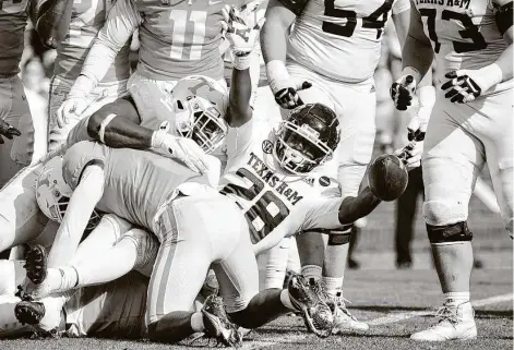  ?? Brianna Paciorka / Associated Press ?? Texas A&M running back Isaiah Spiller celebrates a touchdown in the second quarter. Spiller rushed 26 times for 89 yards.