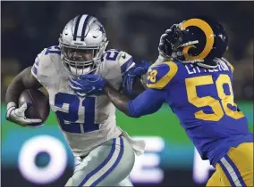  ?? MARK J. TERRILL - THE ASSOCIATED PRESS ?? FILE - In this Jan. 12, 2019, file photo, Dallas Cowboys running back Ezekiel Elliott pushes off Los Angeles Rams inside linebacker Cory Littleton during the first half in an NFL divisional football playoff game in Los Angeles.