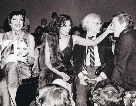  ??  ?? Liza Minnelli, left, Bianca Jagger, Andy Warhol and Halston flocked to Studio 54 in its heyday.