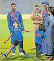  ?? AP ?? Virat Kohli watches Ashish Nehra's son imitate the bowling action of his father, right, at the end of Wednesday’s T20 match.