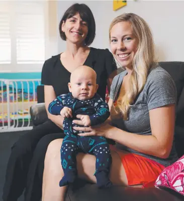  ??  ?? HAPPY BOY: Registered midwife Terri Curcio with Laura Snyder and her 10-week-old son Wyatt Johnson in the new Early Parenting Centre. Picture: STEWART McLEAN