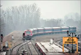  ?? AFP ?? A train during the trial run between Srinagar and Banihal in south Kashmir on Saturday.