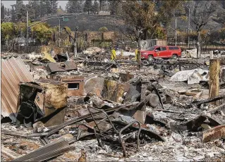  ?? ERIC RISBERG / ASSOCIATED PRESS ?? The remains of Linda Tunis’ home at the Journey’s End Mobile Home Park in Santa Rosa, Calif. Tunis, 69, who was killed in an area wildfire, had moved to Northern California from suburban West Palm Beach last year to be closer to her family. The fires...