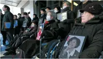  ?? Yonhap ?? Victims of Japan’s wartime forced labor during Japan’s colonial rule and their families attend a press conference in front of the Supreme Court in Seoul, Jan. 25.