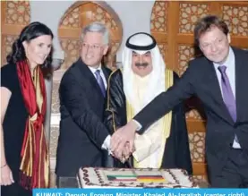  ?? — KUNA ?? KUWAIT: Deputy Foreign Minister Khaled Al-Jarallah (center right) attends the German embassy’s national day ceremony.