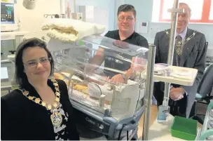  ?? The Mayor of West Lancashire, Cllr Liz Savage, and her consort, Cllr Noel Delaney, meet Daniel Murphy and his son, Corben, at the unit ??