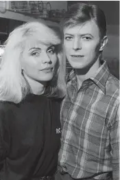  ?? CHRIS STEIN ?? Debbie Harry’s memoir, “Face It,” features archival photos of Blondie in the 1970s and 1980s, including this portrait with David Bowie.