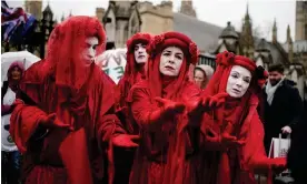  ?? Photograph: Jordan Pettitt/PA ?? ‘I’ve decided to shut up and wrap myself in a red sheet instead.’ Members of the Red Rebel Brigade in London on 24 April 2023.