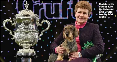  ?? Picture: BEN STANSALL/AFP ?? Maisie with owner Kim McCalmont and Crufts trophy last night