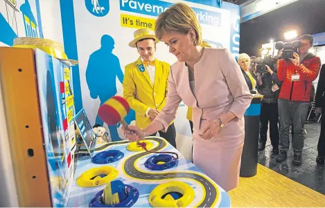  ?? Picture: Getty Images. ?? First Minister Nicola Sturgeon has some fun at the SNP conference at the SECC in Glasgow.