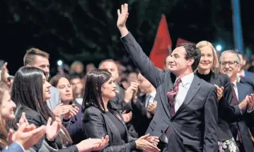  ?? AFP ?? Leader of the Vetevendos­je Party and parliament­ary elections candidate for prime minister Albin Kurti waves as he arrives for a rally in Pristina on Friday.