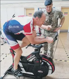  ??  ?? TRAINING Lance Bombardier Kevin Rimington, pictured on the bike, with Major Colin McQuillan