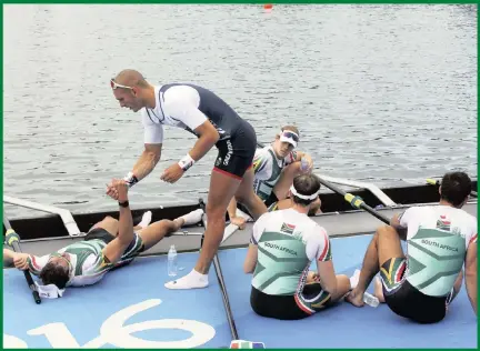  ??  ?? A member of Britain’s men’s fours team greets South Africa’s David Hunt, Jonty Smith, Vincent Breet and Jake Milton Green.