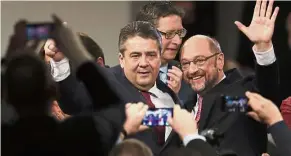  ??  ?? Merkel’s match: Gabriel (left) and Schulz arriving for an extraordin­ary party convention in Berlin. — AP