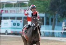  ?? NYRA PHOTO BY ADAM MOOSHIAN ?? Mike Smith rides Songbird back towards the grandstand after winning the Coaching Club American Oaks July 24, 2016 at Saratoga Race Course. The filly, arguably the top horse in training, is being pointed at the Personal Ensign on Travers Day Saturday.