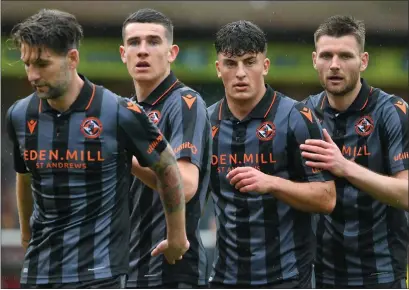  ?? ?? Lewis Neilson, second-right, has signed for Hearts, with Dundee United arguing they are due compensati­on