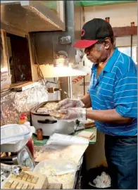  ?? Arkansas Department of Parks and Tourism/a.c. “CHUCK” HARALSON ?? It’s usually a one-man operation at Jones’ BAR-B-Q Diner — Harold Jones makes the sandwiches and operates the cash register.