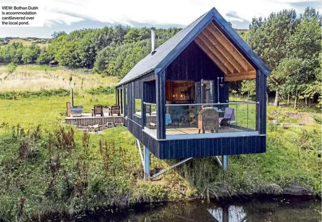  ?? ?? VIEW: Bothan Dubh is accommodat­ion cantilever­ed over the local pond.