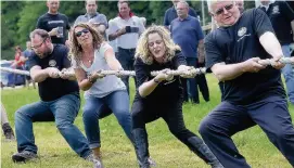  ?? Pictures: Matt Ratcliffe ?? ●● Tug-o-war teams competed for a cask of beer