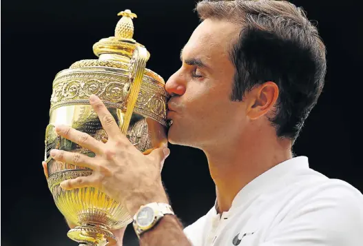  ?? Picture: GETTY IMAGES ?? HISTORIC MOMENT: Roger Federer, of Switzerlan­d, celebrates victory after the men’s singles final against Marin Cilic, in London, England, yesterday