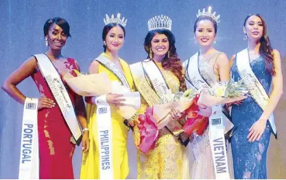  ??  ?? Julie Ann Tricia Manalo (second from left), second runner-up in the 2017 Miss Tourism Universe, with (from left) Portugal’s Tessy Ramos (fourth runner-up), India’s Nishita Purandare (winner), Vietnam’s Mau Thi Hong Dung (first runner-up) and Romania’s...