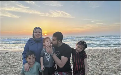  ?? MOSAB ABU TOHA VIA THE NEW YORK TIMES ?? Palestinia­n poet Mosab Abu Toha, at a beach with his family, said he was not aware of any facial recognitio­n program in Gaza.