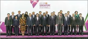 ?? NICHOLAS YEO/AFP ?? Asian foreign ministers and central bank governors pose for a group photograph at the Asean Finance Ministers’ and Central Bank Governors’ meeting in Singapore on Friday.