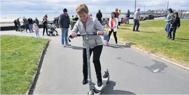 ??  ?? Complaint Nicola Sturgeon riding the e-scooter on a visit to Troon during this May’s Scottish election campaign