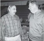  ?? STAFF PHOTO BY RON BUSH ?? TCCAA commission­er Foster Chason, right, chats with NJCAA Region VII men’s director Bobby Hudson at the state/region basketball tournament at Chattanoog­a State, where Chason worked for 30 years.