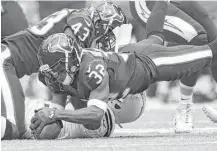  ?? Elizabeth Conley / Houston Chronicle ?? Robert Nelson recovers a fumble against the Chargers on Nov. 27. The corner has had his ups and downs since being activated.