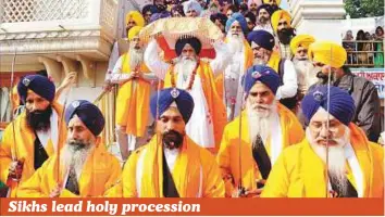  ?? PTI ?? Panj Pyare (five beloved ones) leading a Nagar Kirtan procession at the Golden Temple on the eve of martyrdom day of ninth Sikh Guru Tegh Bahadur Ji in Amritsar, yesterday.