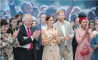  ?? ARTHUR EDWARDS, POOL PHOTO VIA AP ?? Prince Harry, second right, and Meghan Duchess of Sussex attend the launch of the Nelson Mandela Centenary Exhibition, marking the 100th anniversar­y of the anti-apartheid leader’s birth, at Queen Elizabeth Hall in London on Tuesday.