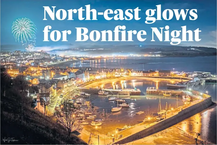  ?? ?? SPECTACULA­R: Stonehaven harbour shines bright against the inky-blue night as fireworks light up the sky overhead. Picture by Ryan Hutton.