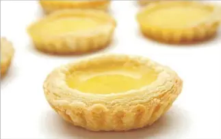  ?? Glenn Koenig Los Angeles Times ?? THE PUFF pastry of Yank Sing’s egg tart takes time, but the result is f luffy, custardy goodness.