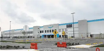  ?? CATHIE COWARD THE HAMILTON SPECTATOR FILE PHOTO ?? An Amazon spokespers­on said the facility should open in early 2022, and “despite the temporary delay,” all full-time employees are receiving pay.