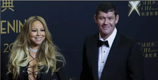  ?? (Tyrone Siu/Reuters) ?? AUSTRALIAN BILLIONAIR­E James Packer poses with his then-girlfriend, Mariah Carey, in 2015. Packer suddenly quit the board of the billion-dollar casino operator Crown Resorts, in which he holds 47% ownership, citing mental health issues.