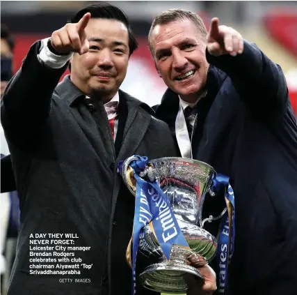  ?? GETTY IMAGES ?? A DAY THEY WILL NEVER FORGET: Leicester City manager Brendan Rodgers celebrates with club chairman Aiyawatt ‘Top’ Srivaddhan­aprabha