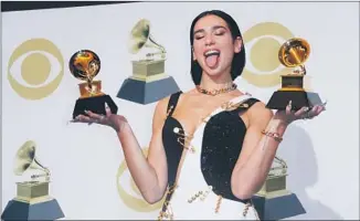  ?? Marcus Yam Los Angeles Times ?? BRITISH pop singer Dua Lipa picks up two Grammys, including new artist, on Sunday evening.