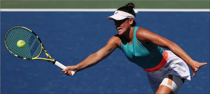  ??  ?? American Jennifer Brady plays a return during her resounding victory over Yulia Putintseva in the quarter- finals of the US Open last night to book a spot in the last four