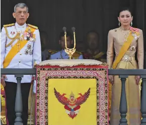 ??  ?? Vajiralong­korn and Suthida grant a public audience on the final day of his royal coronation in Bangkok, Thailand.