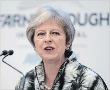  ?? MATT CARDY GETTY IMAGES ?? British Prime Minister Theresa May opened the Farnboroug­h Airshow with a speech pledging funding for the aerospace industry.