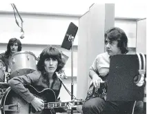  ?? GAT ?? George Harrison, left, and Joe Osborn. The overwhelmi­ng emotion that comes through in this 2008 documentar­y is joy.