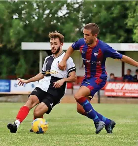  ?? Picture: Haydn Jones ?? An Ashton & Backwell player, right, battles for the ball during the goalless draw against Shepton Mallet in a Toolstatio­n League Premier Division game on August Bank Holiday Monday