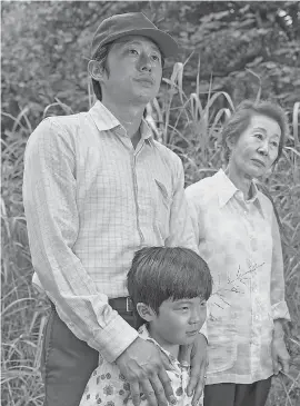  ??  ?? Steven Yeun, left, Alan S. Kim and Yuh- jung Youn star in “Minari.” PROVIDED BY JOSH ETHAN JOHNSON/ A24