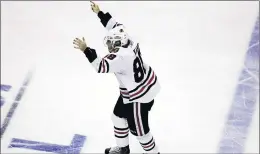  ?? BRIAN CASSELLA / CHICAGO TRIBUNE ?? Patrick Kane starts his celebratio­n after his overtime goal gave the Chicago Blackhawks the series win in Game 6 of the 2010 Stanley Cup Finals.