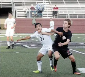  ?? Graham Thomas/Siloam Sunday ?? Siloam Springs midfielder Irvin Rios fights with Benton’s Pat Stokes during a 6A-West Conference Tournament semifinal match Thursday at Panther Stadium in Siloam Springs.