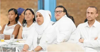  ?? PICTURE: BHEKI RADEBE ?? NEED ANSWERS: Zainab Salasa, front, Alecia Amsterdam, Shahieda Schoeman, Soraya Schoeman and Fuddlunn Salasa were among those at a White Sunday event in Mitchells Plain yesterday.